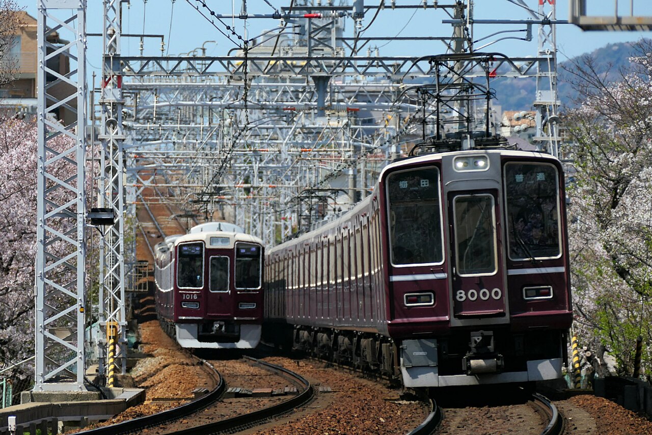 Hankyu 8000 and 1000 series trains running between Mikage and Okamoto on the Kobe Main Line.