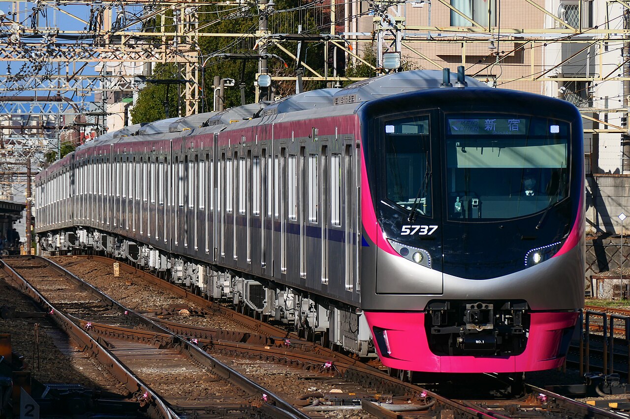 Keio 5000 series formation 5737 on a Keio Liner service, passing through Sakurajosui Station on the Keio Line.