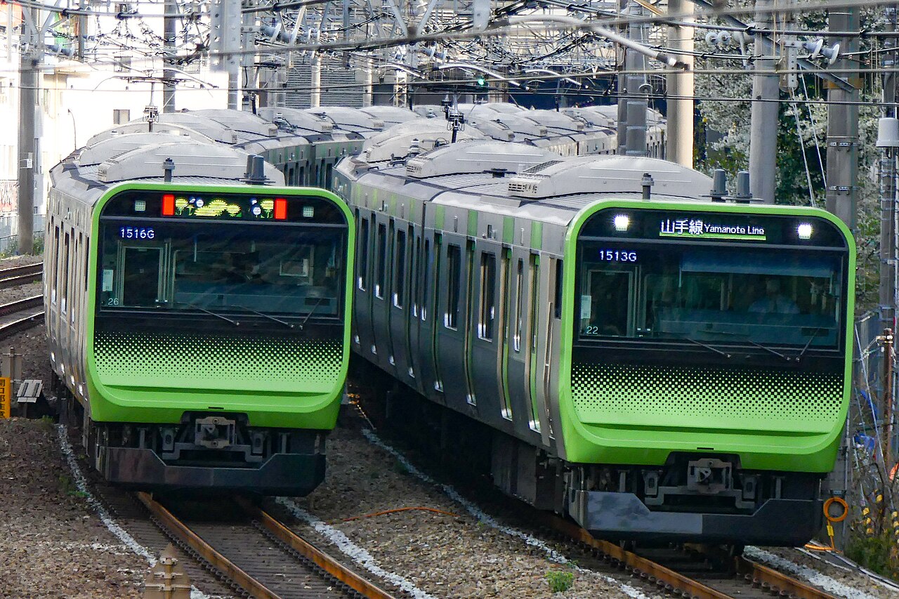 JR East E235 series trains passing between Ebisu and Shibuya on the Yamanote Line.