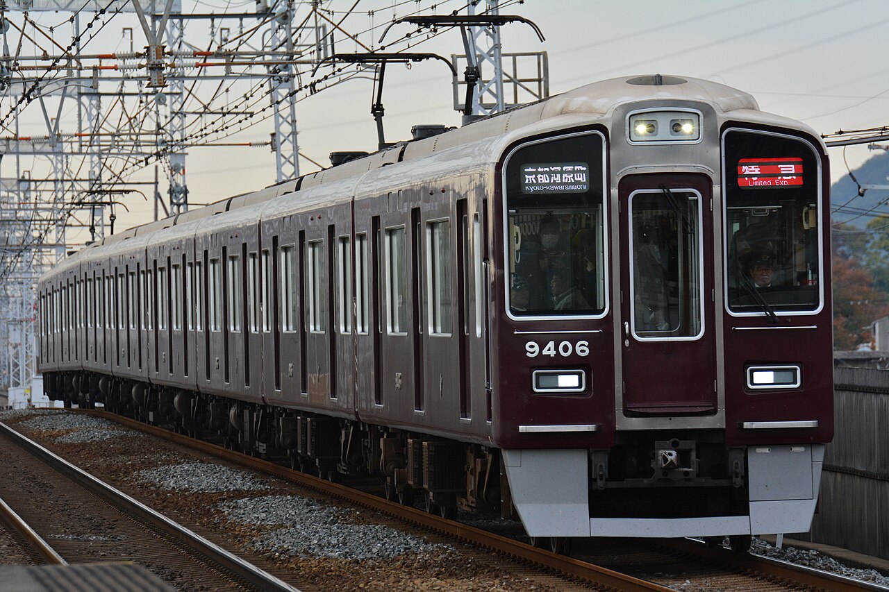 A Hankyū 9300 series electric multiple unit in the company’s signature maroon livery.