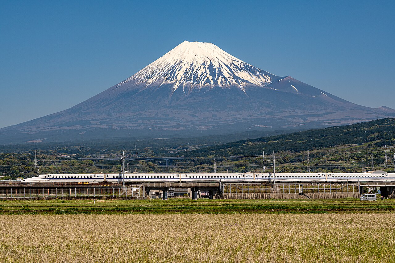 An N700A series Shinkansen at Higashi-Tagonoura with Mount Fuji in the background.